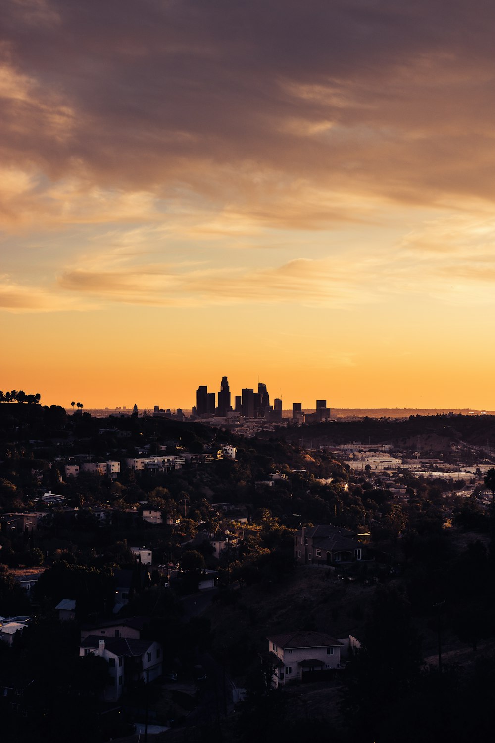 a city with a sunset in the background