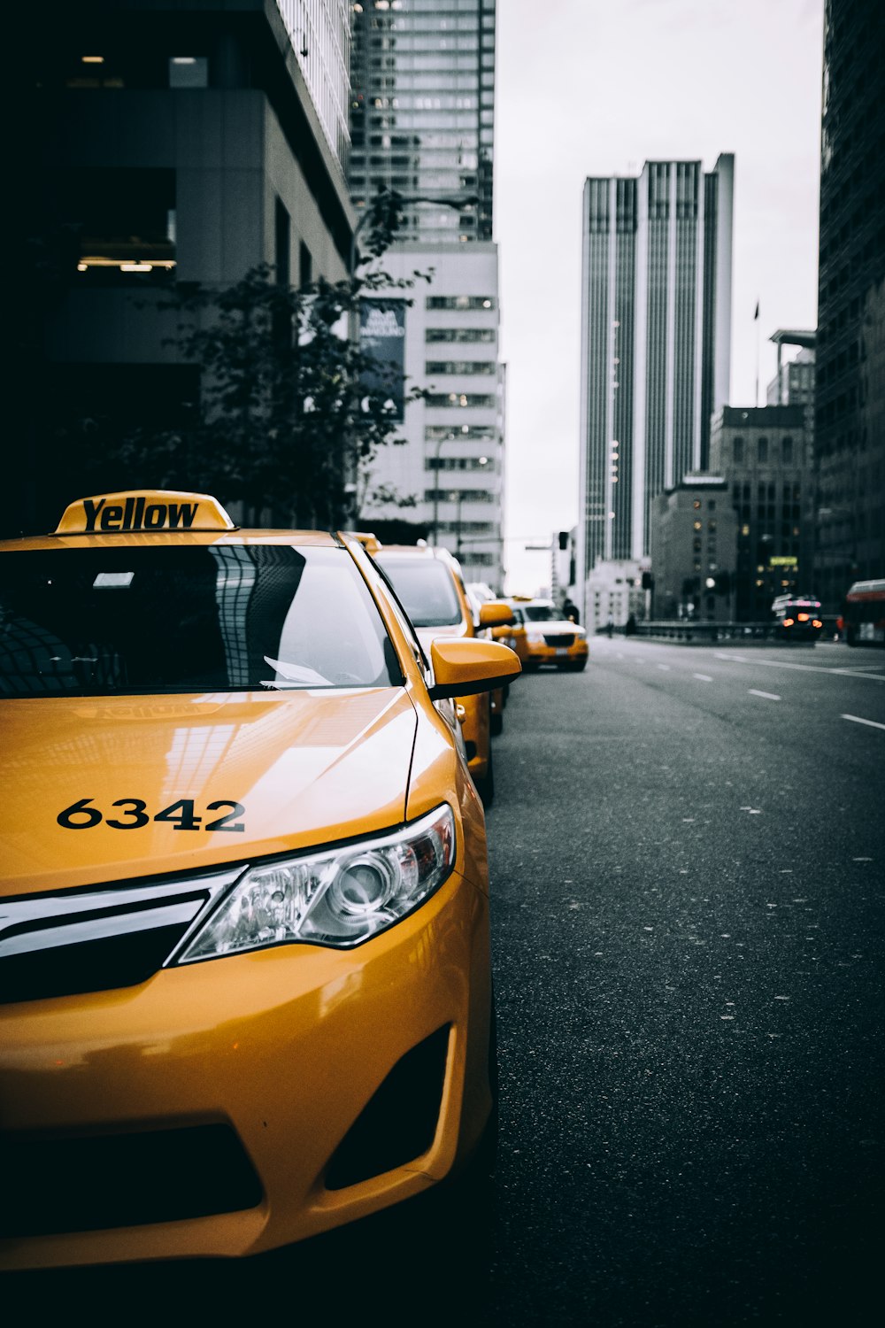 a yellow taxi cab on a street