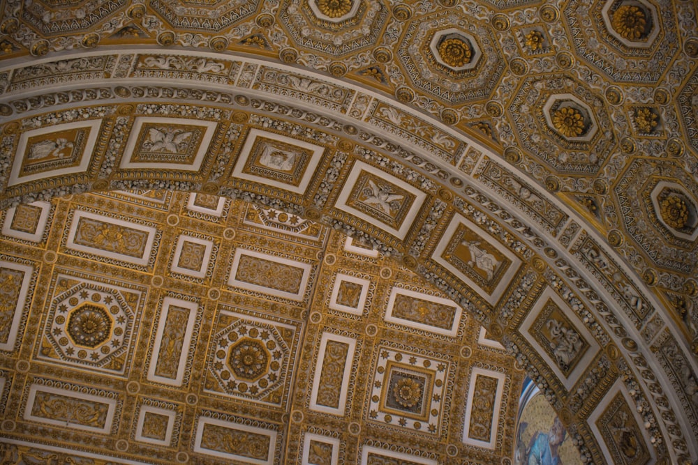 a ceiling with many intricate designs