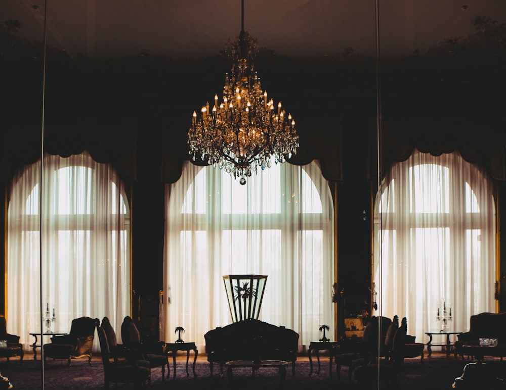 a chandelier from a ceiling in a room with a stage