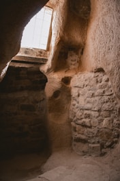 Small dungeon room with stone walls and atmospheric candles.