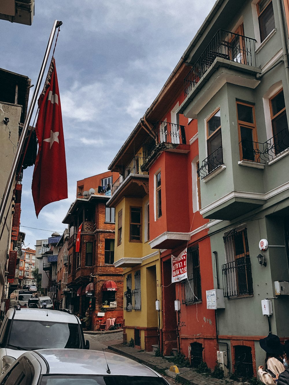 a row of buildings with a flag