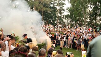 a group of people watching a band on stage