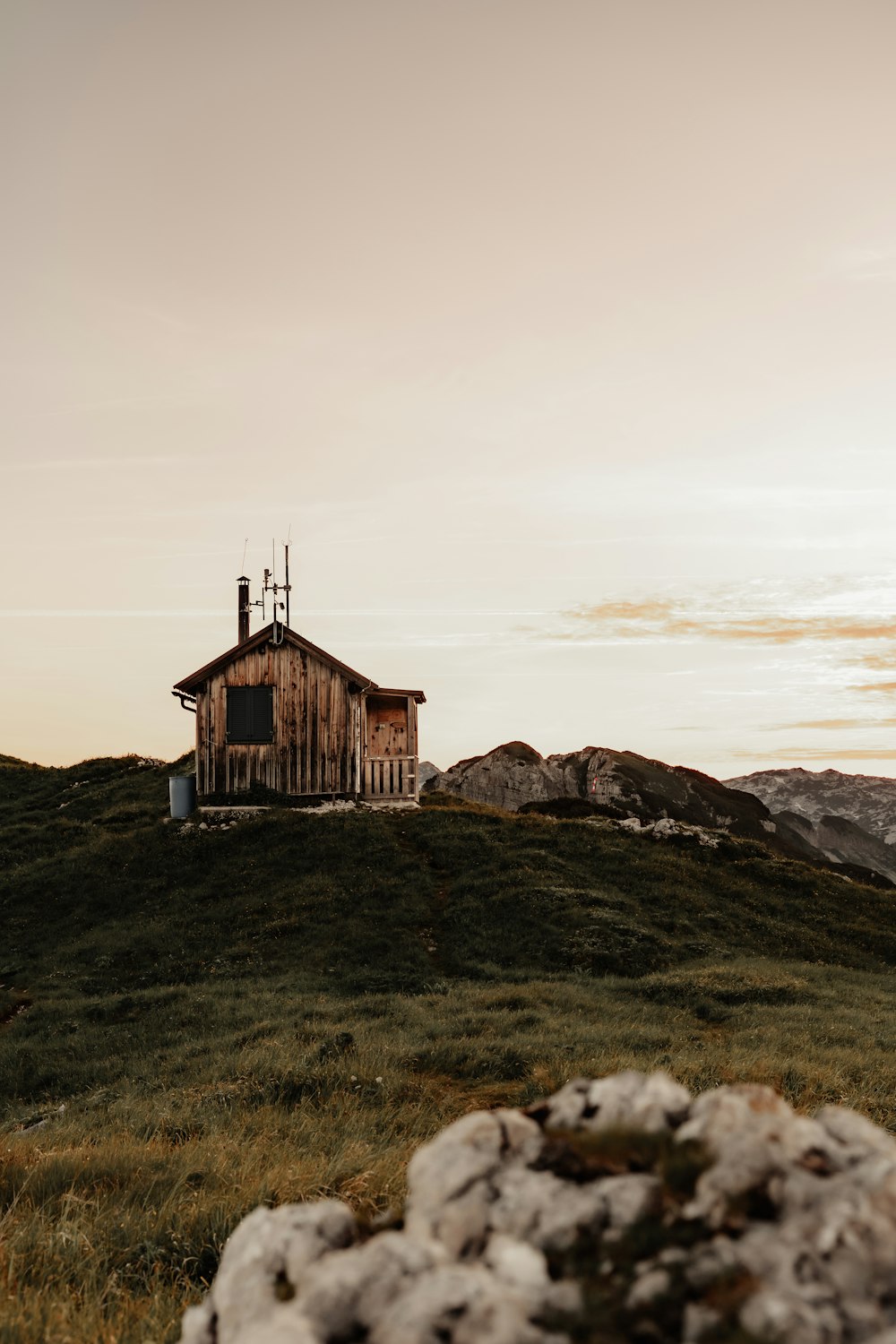 a small house on a hill