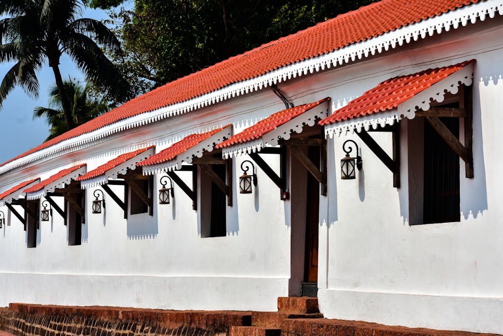 a white building with a red roof