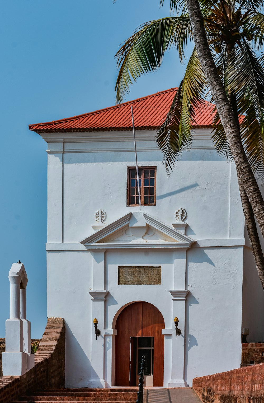 a white building with a red roof