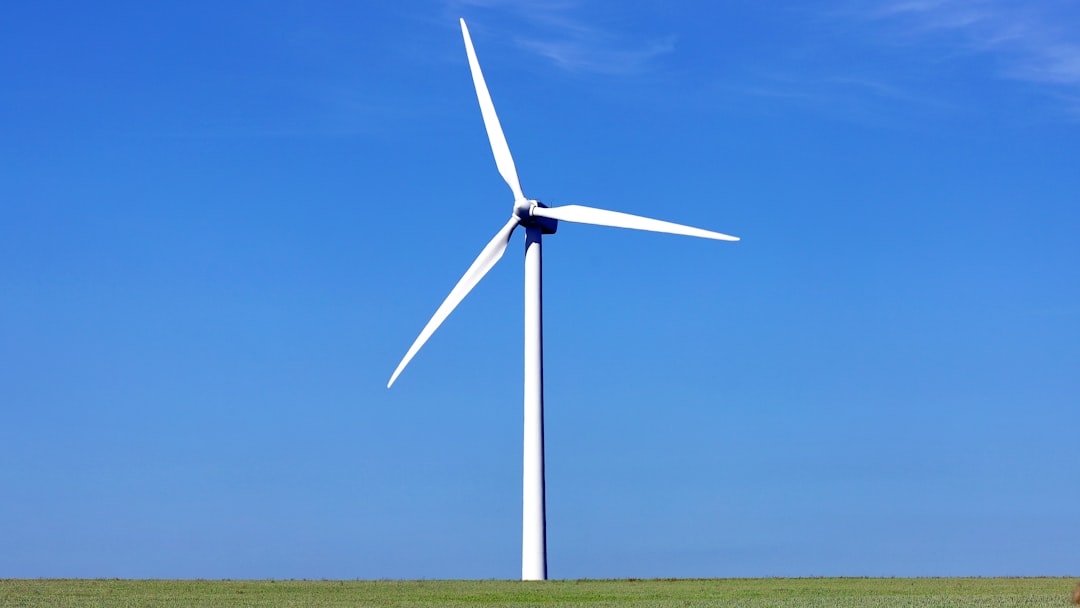 a windmill in a field, Onshore wind power turbine