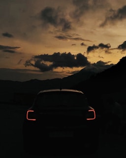 Evening shot of the car silhouetted against vibrant skies on a journey back to Bhubaneswar