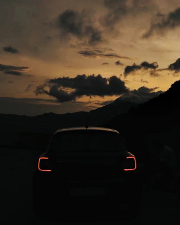 Evening shot of the vehicle illuminated by city lights in East Bay.