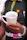 Close-up of a ceramic mug featuring Cuban artwork, held by hands with a Cuban flag bracelet.