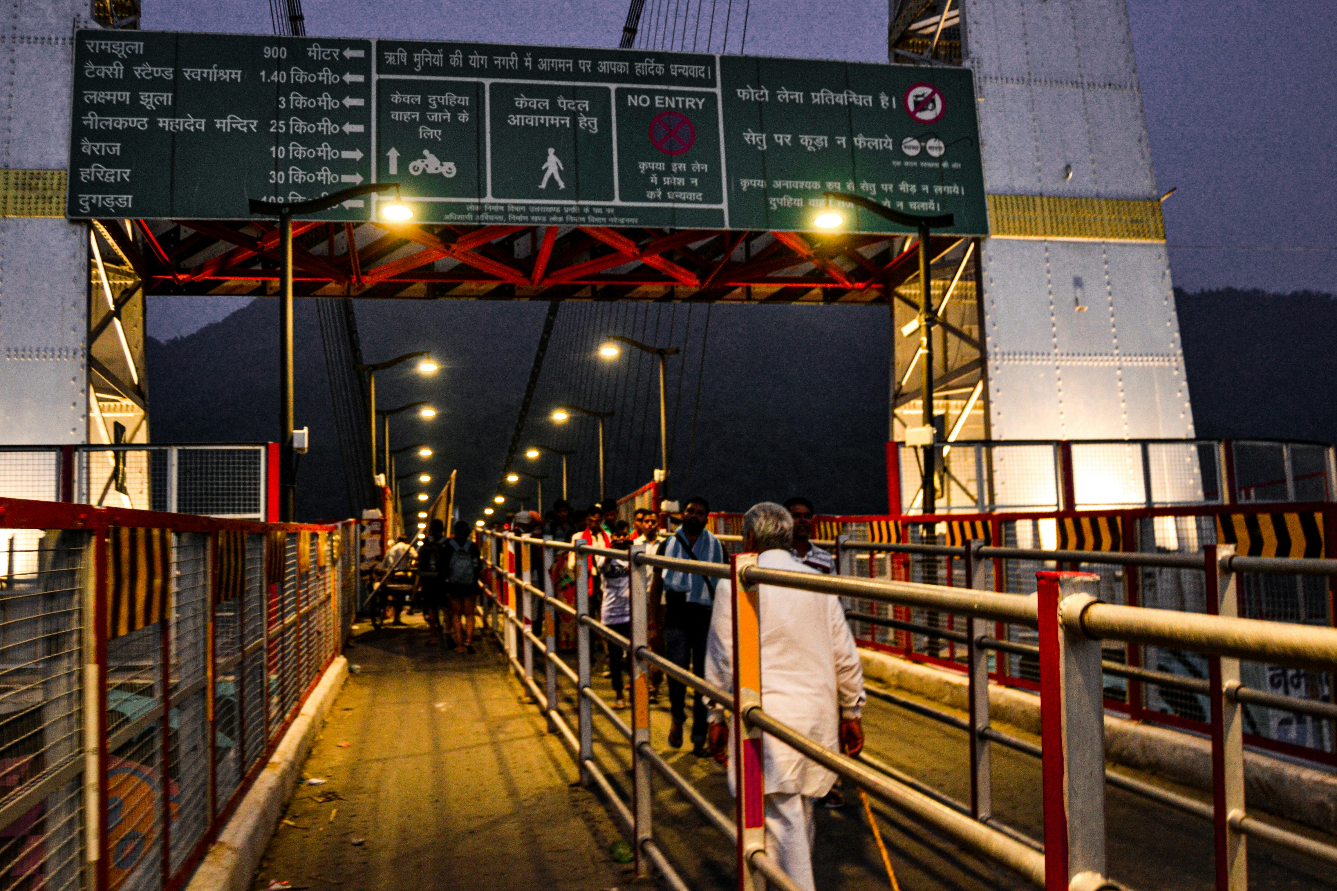 An artistic rendering or blueprint of the Rishikesh-Karnaprayag rail line passing through tunnels and over bridges in the majestic Himalayan landscape.