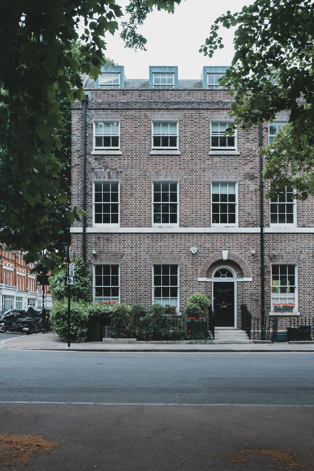 a brick building with a black door