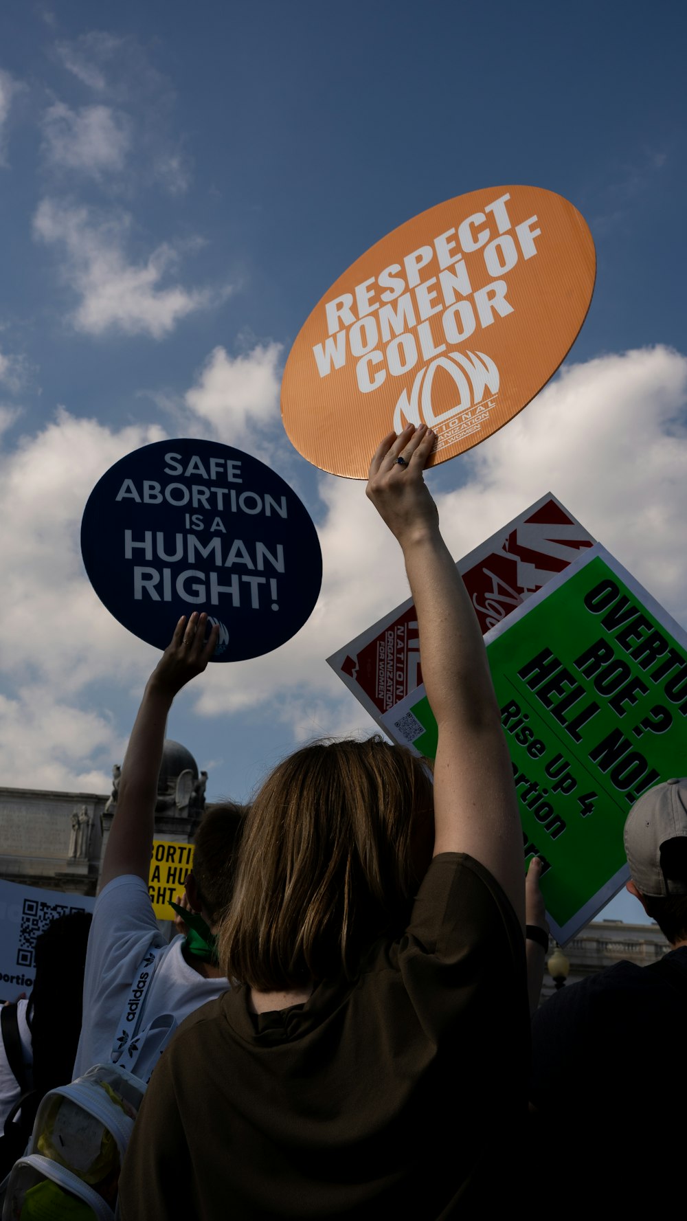 a group of people holding signs