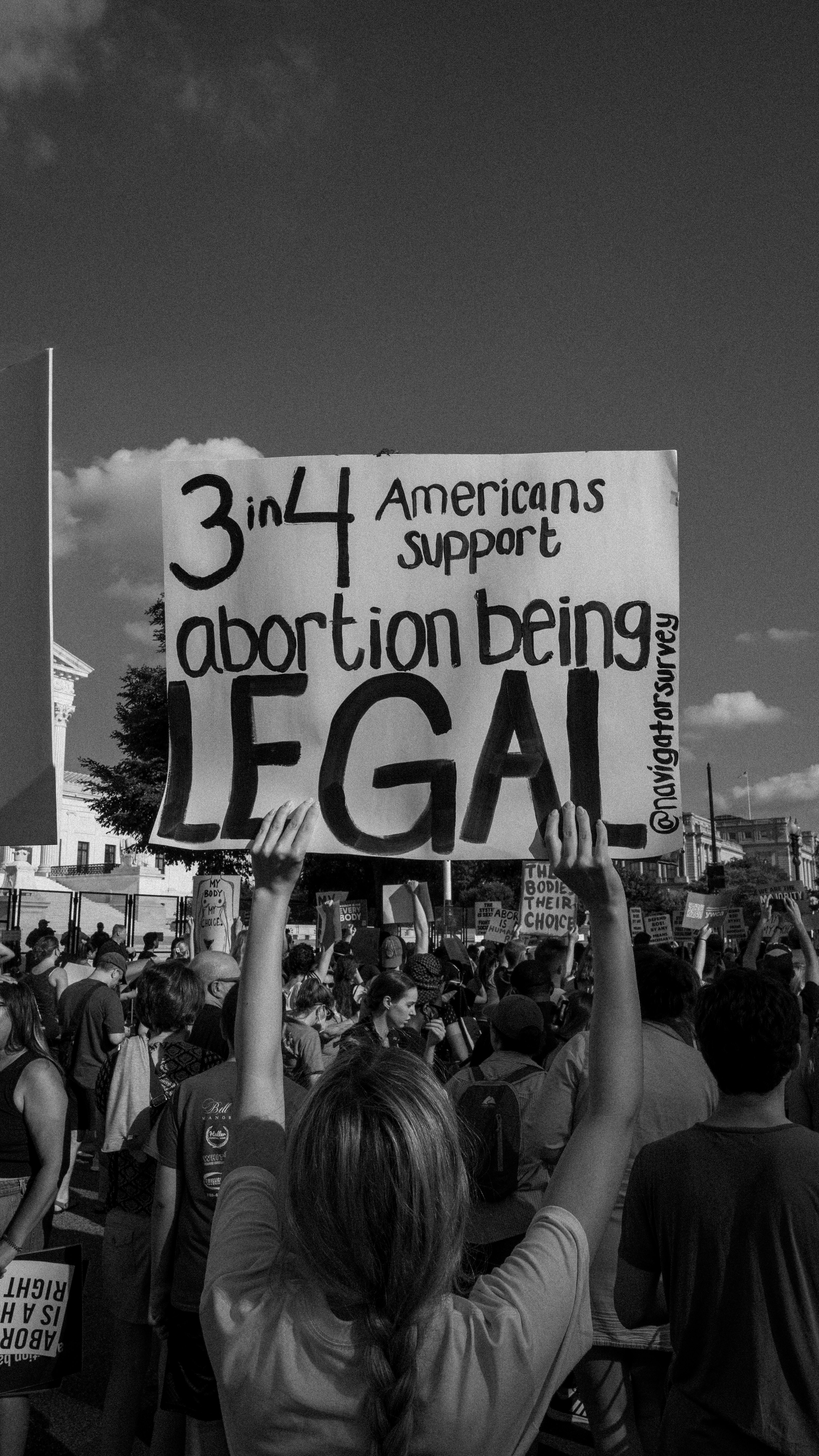 a group of people holding a sign