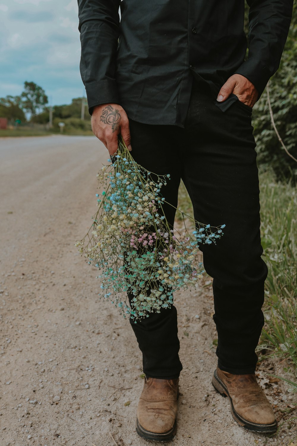 a man holding a bouquet of flowers