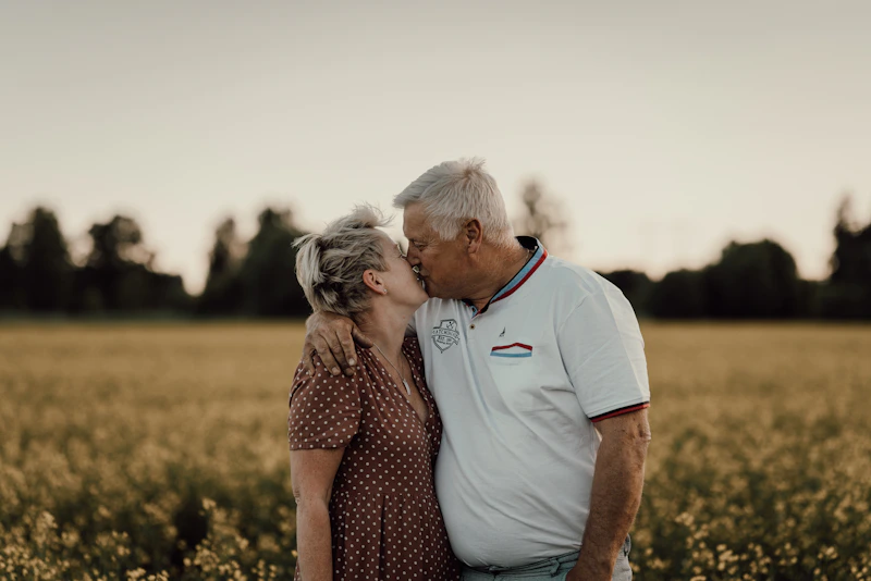 an older couple is kissing