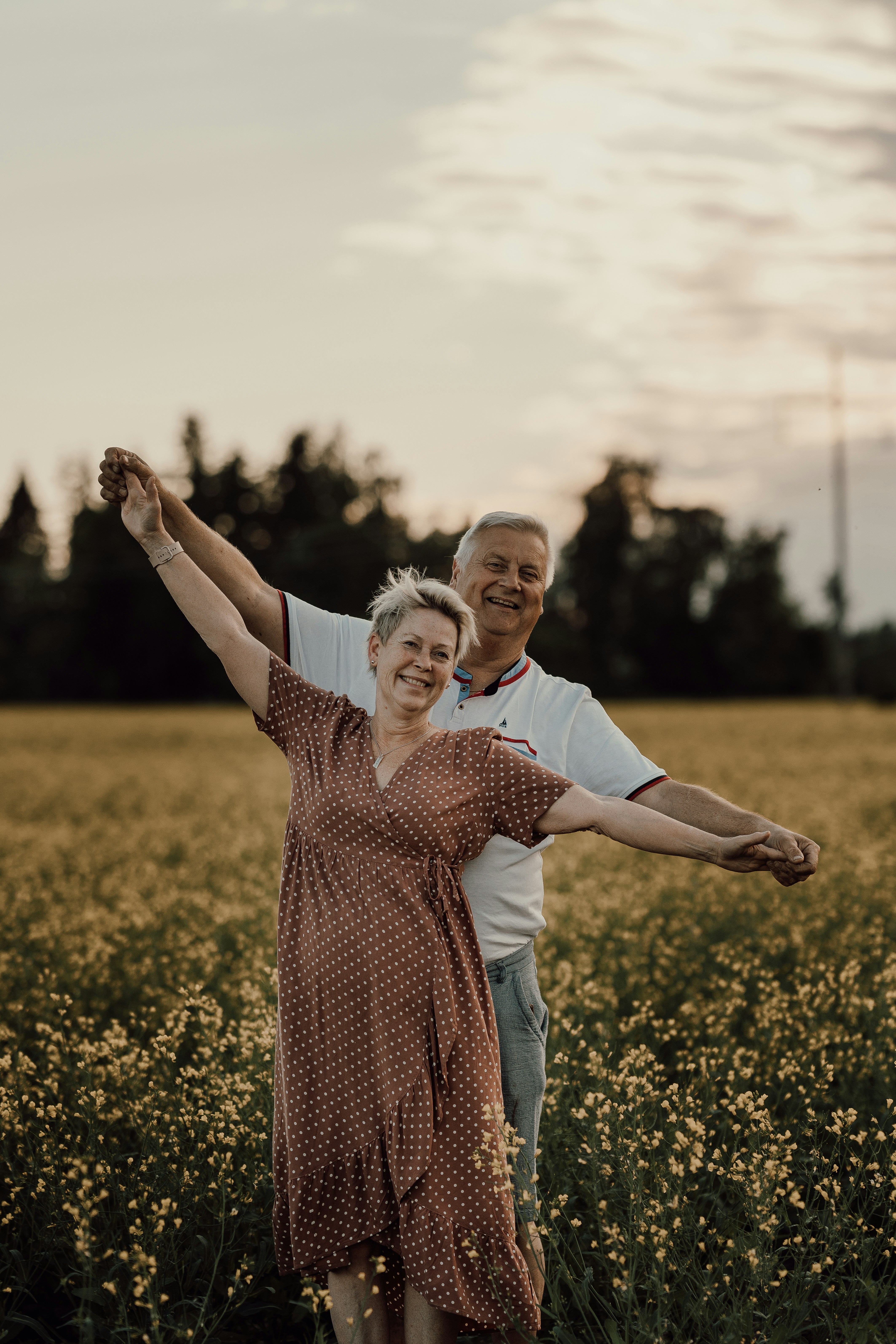 A man and woman in a field of flowers photo – Free Portrait Image on ...