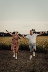 a man and woman jumping in the air