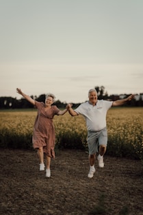 a man and woman jumping in the air