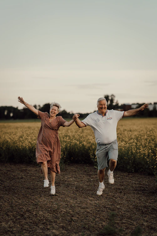 a man and woman jumping in the air