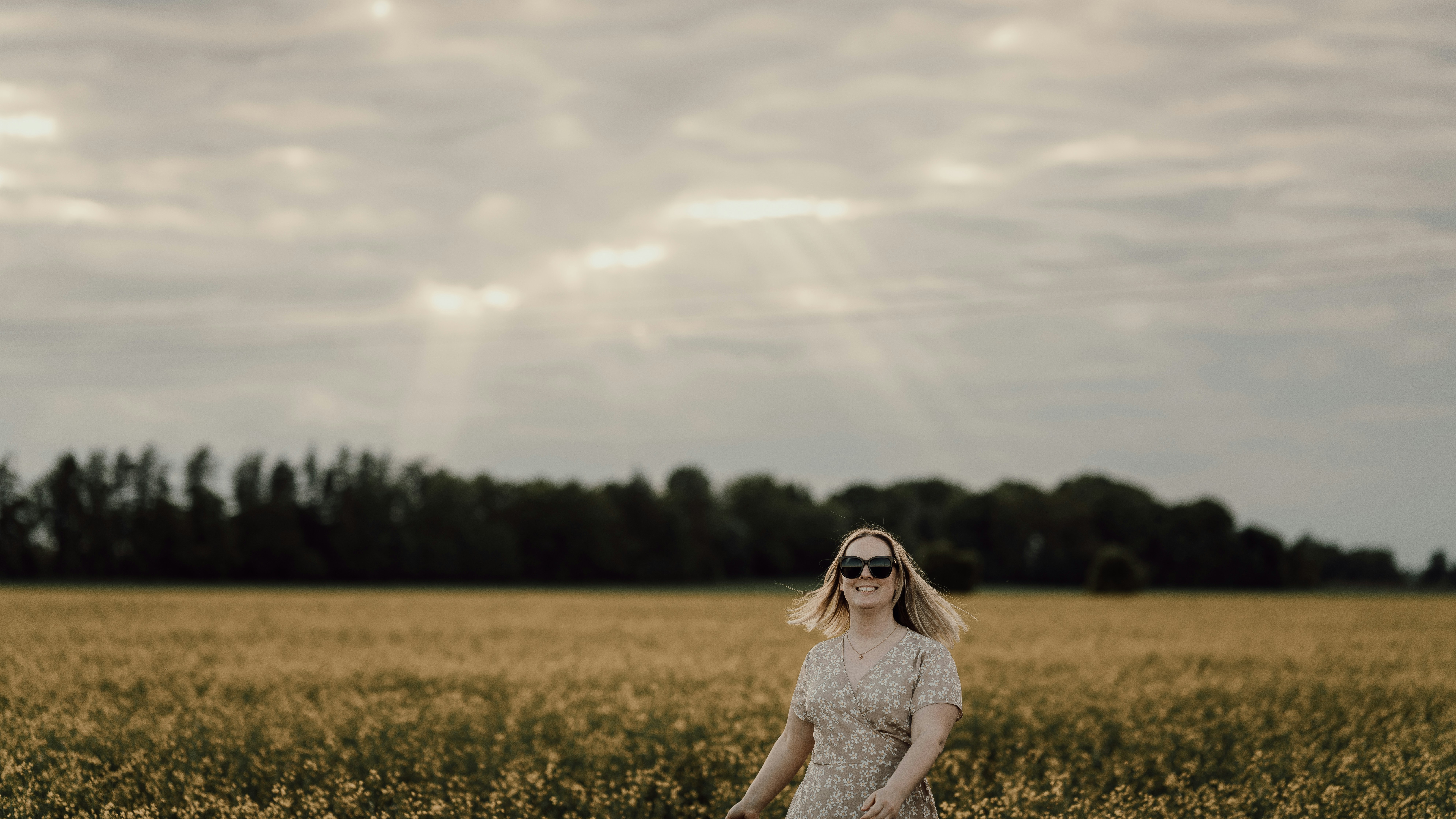 a person standing in a field of flowers
