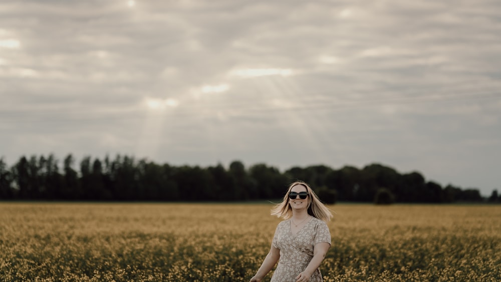 a person standing in a field of flowers