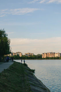 Guests enjoying a peaceful morning walk along the riverside pathway near the hotel.