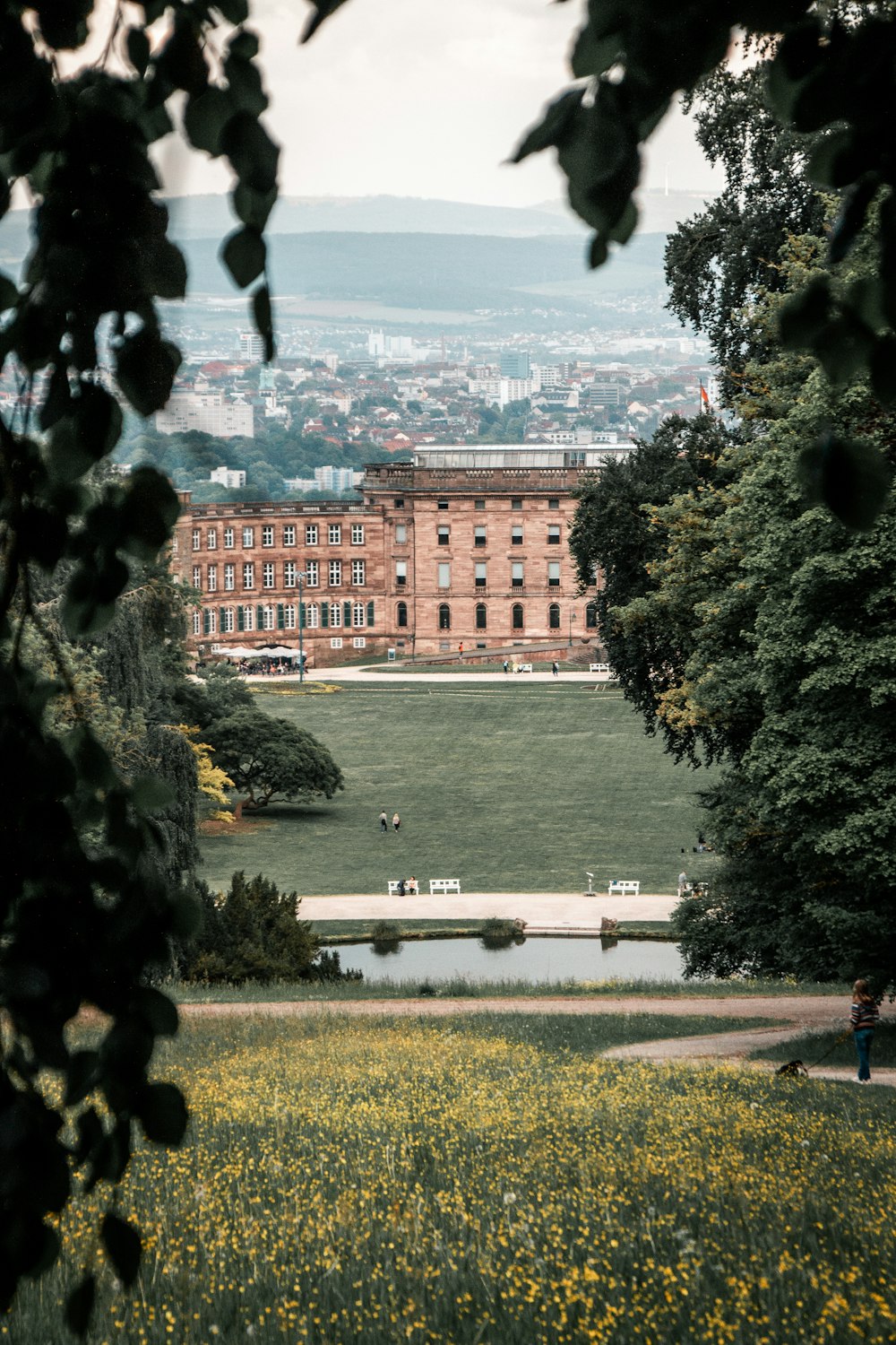 a building with a pond in front of it