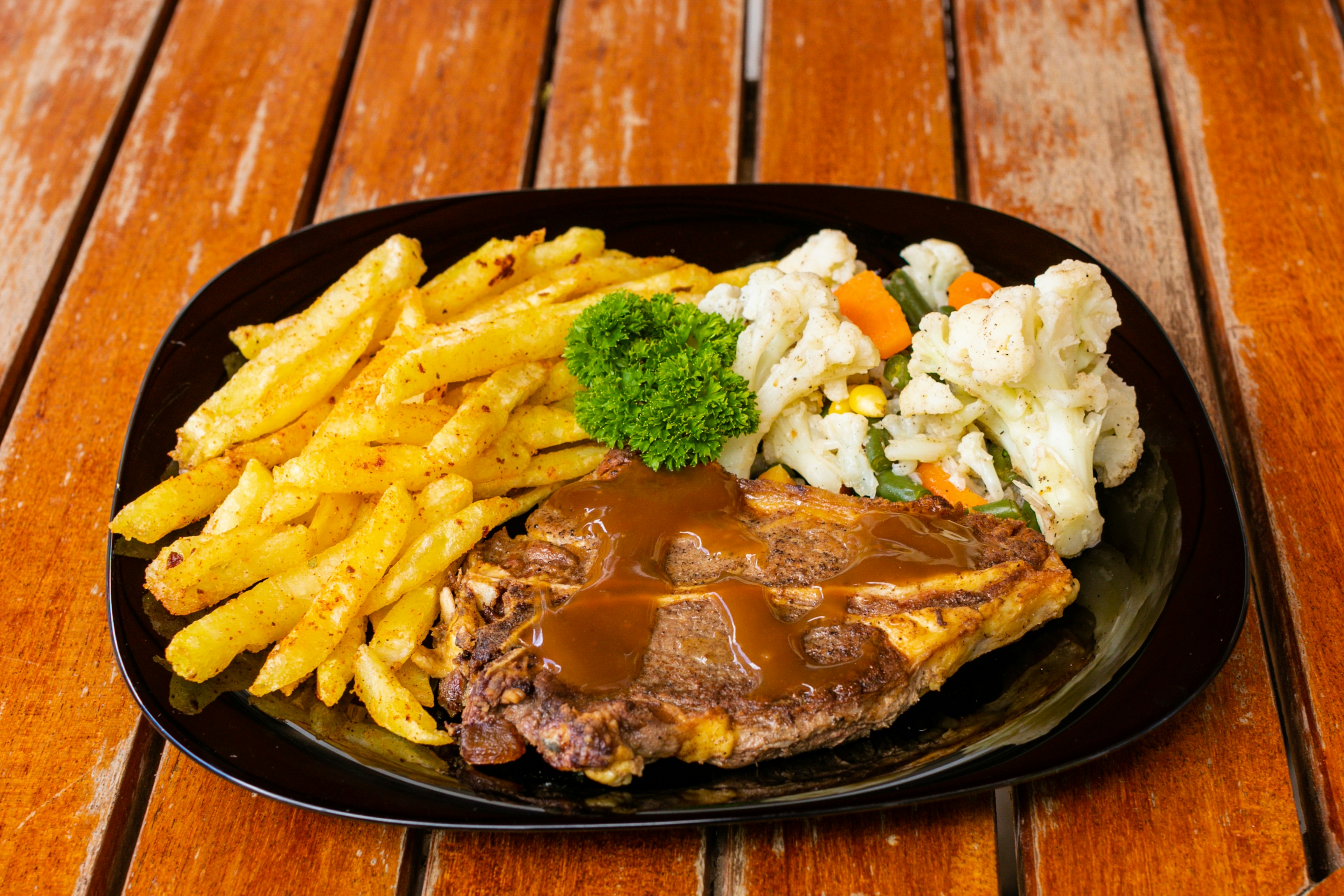 The Origin of Grits and Steak on Restaurant Menus
