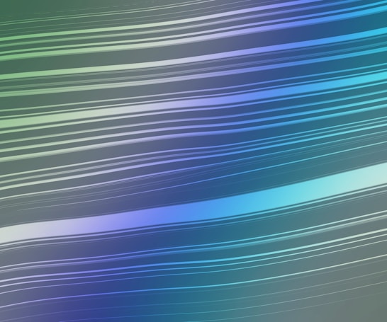 A series of smooth, curved lines in varying shades of blue and green run horizontally across a soft gradient background. The lines are evenly spaced and vary in thickness, creating a sense of motion and fluidity.