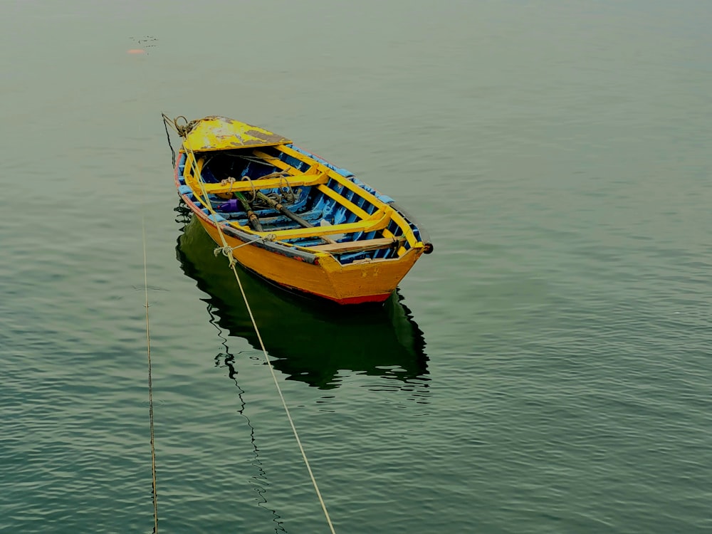 a yellow boat in the water