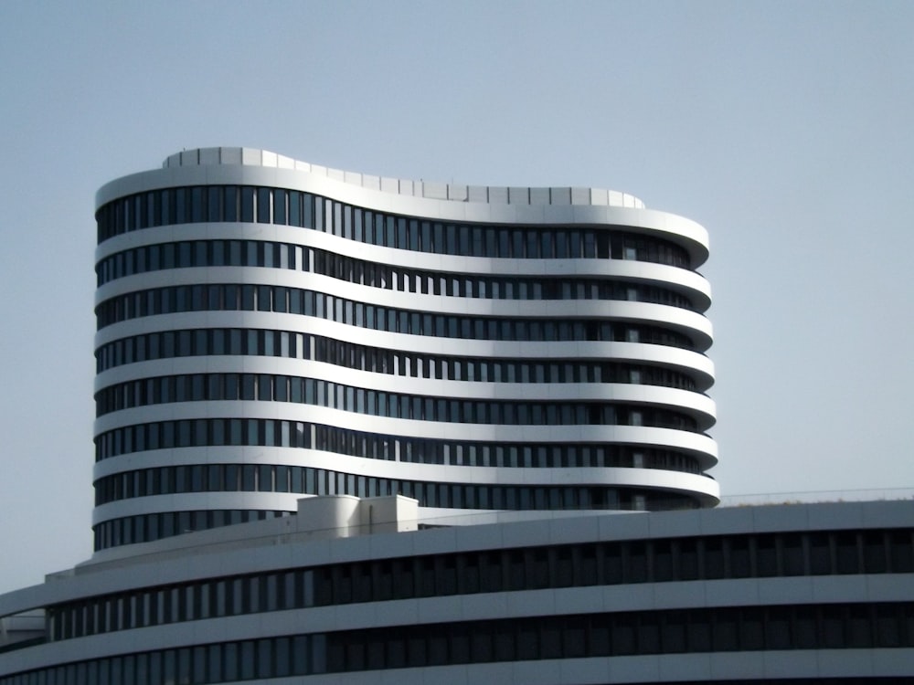 a tall building with a curved top