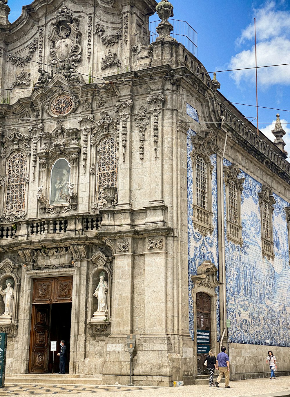 a building with statues on the side