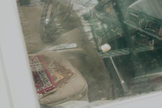 Before and after shot of carpet restoration in a vehicle.