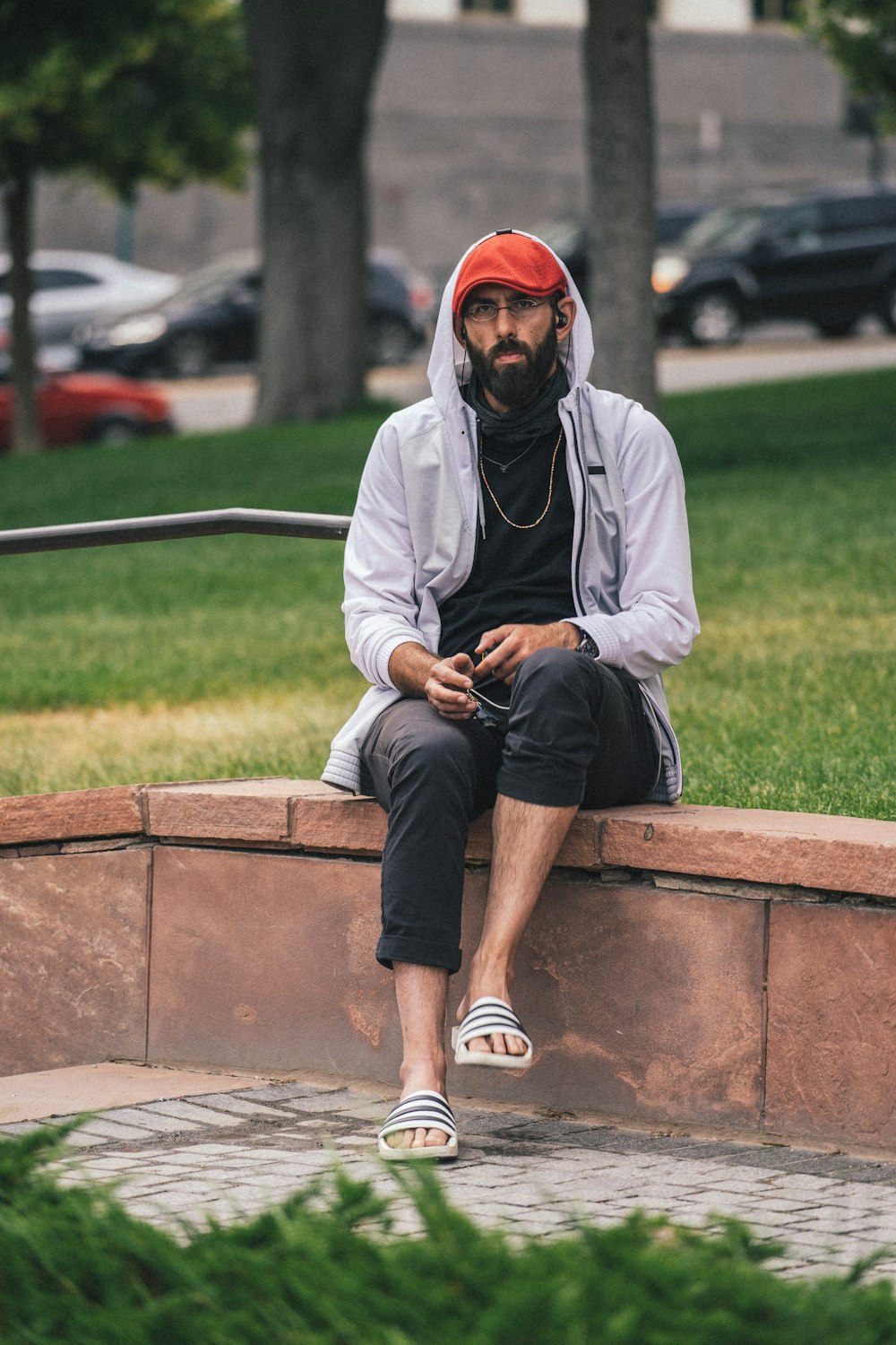 a man sitting on a wall