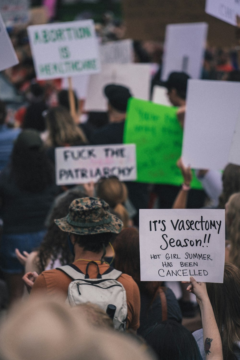 a group of people holding signs