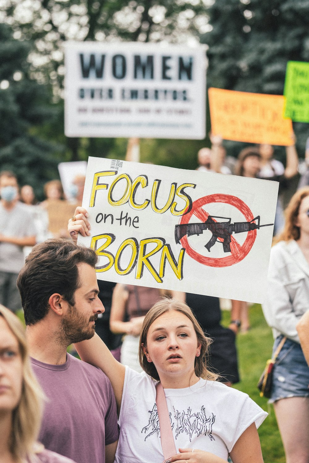 a group of people holding signs