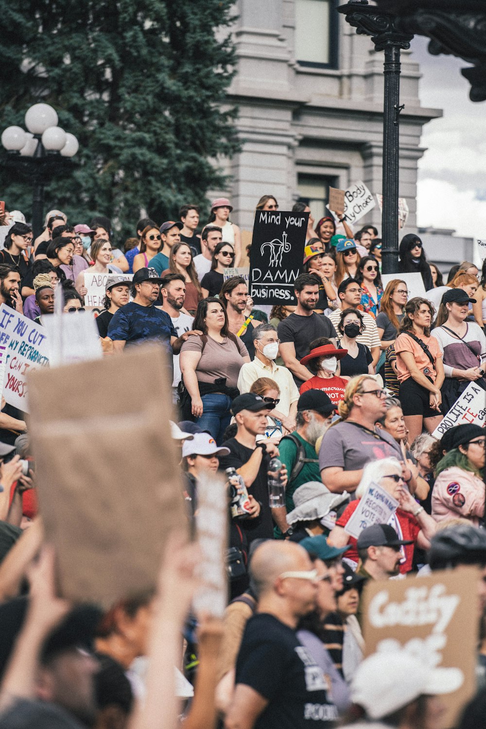 a group of people holding signs