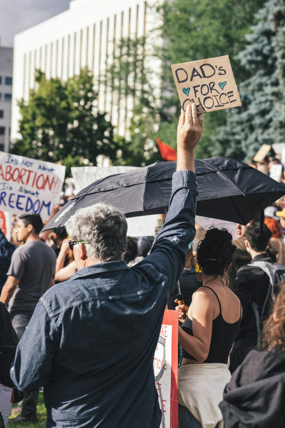 a man holding a sign and a sign