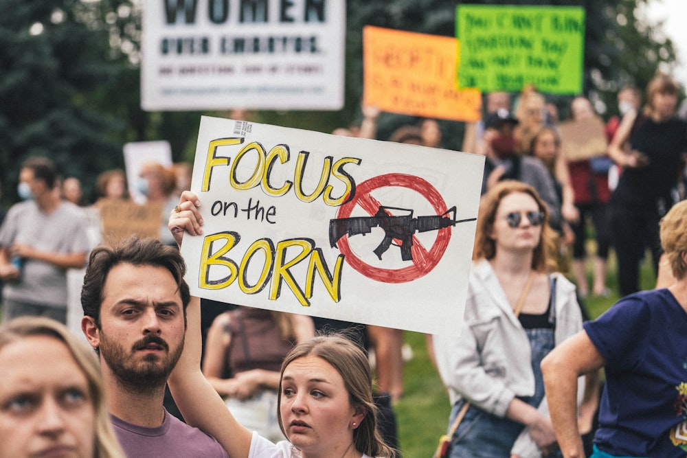 a group of people holding signs