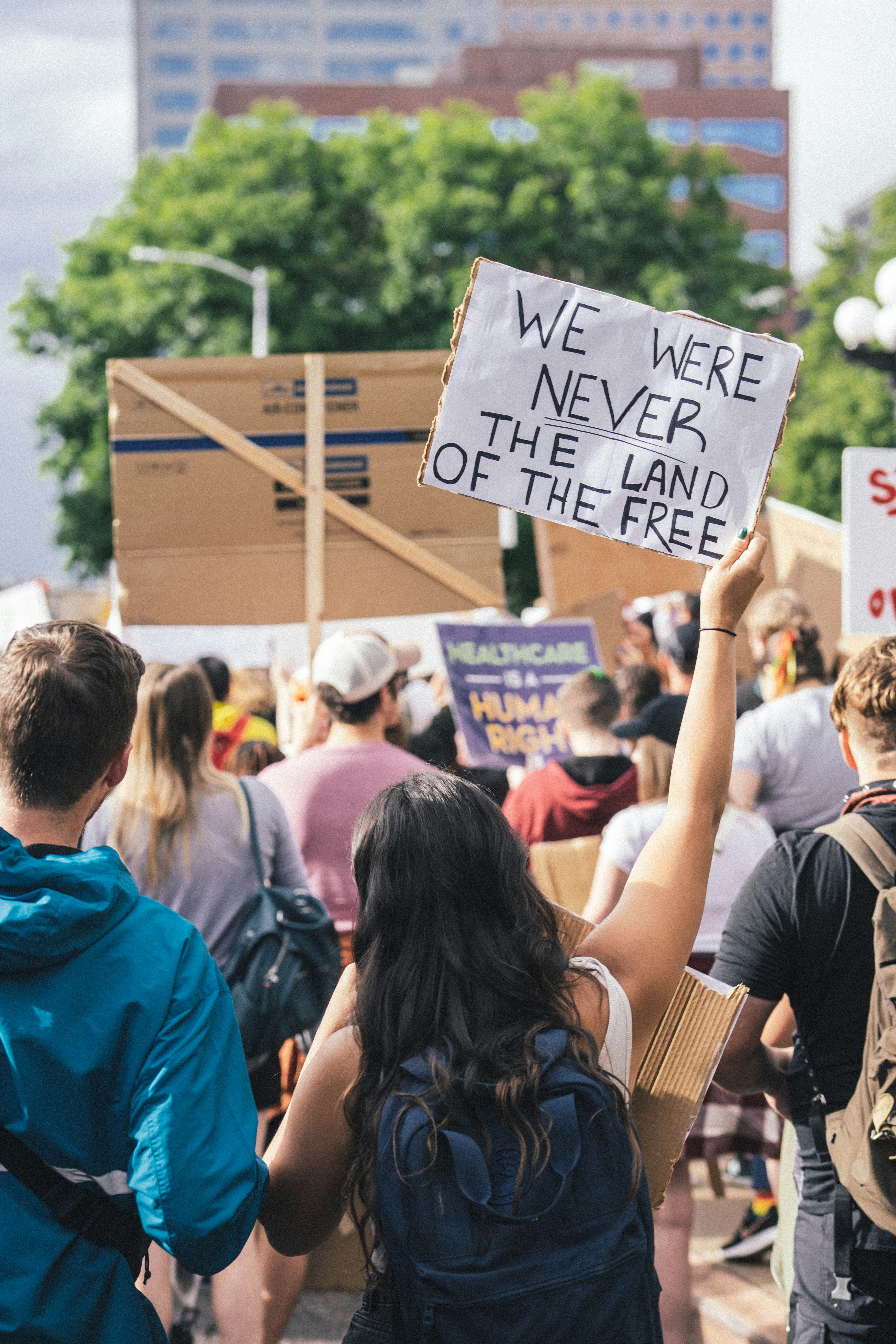 a group of people holding signs