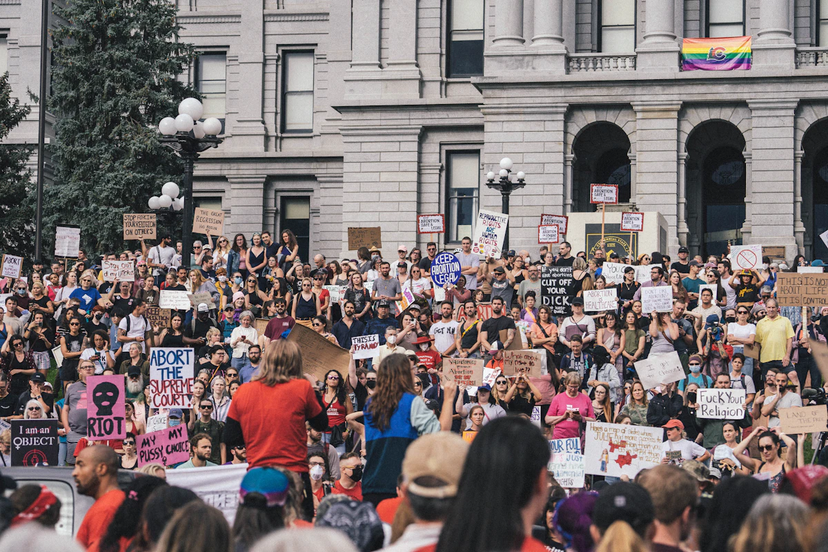 Protesters march with flags during a rights rally