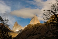 a rocky mountain with trees