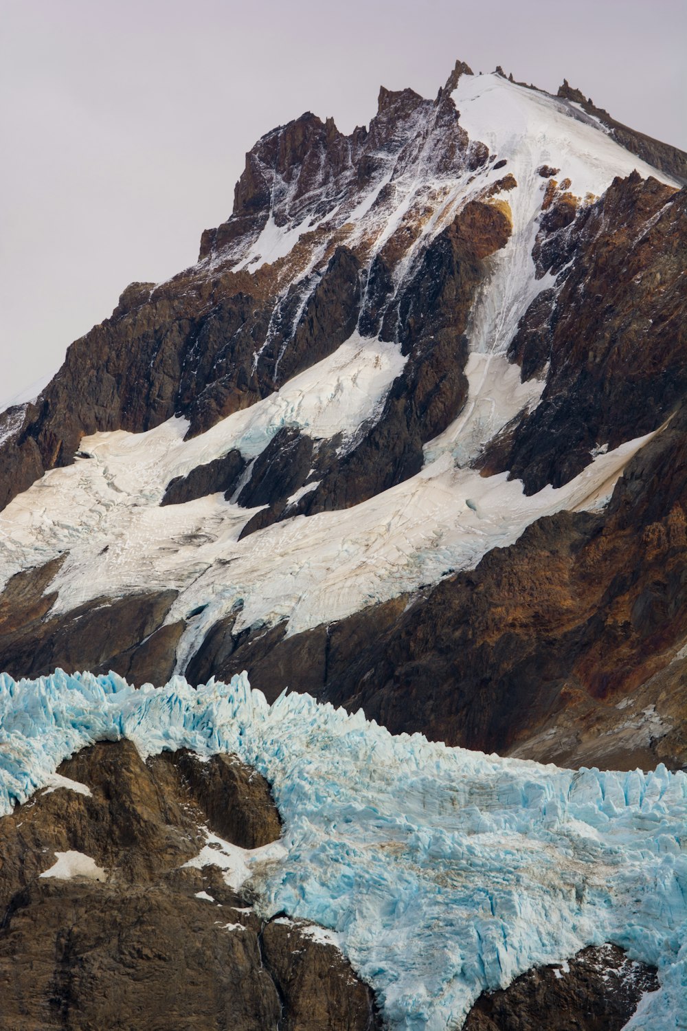 a rocky mountain with snow