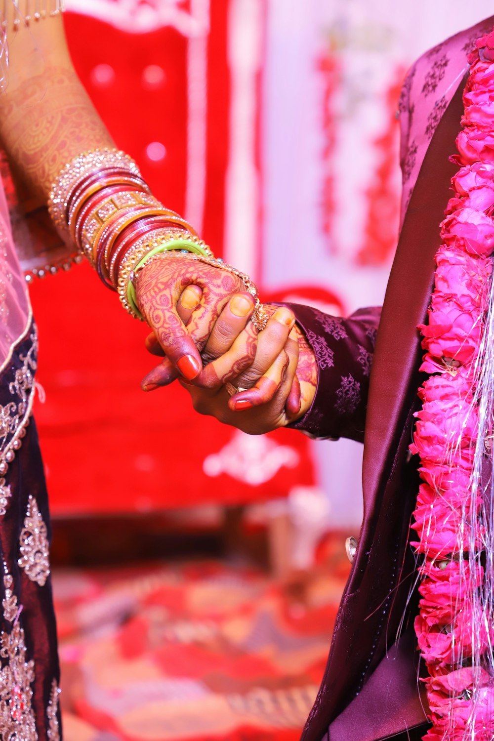 a person's hands on a red and white cloth