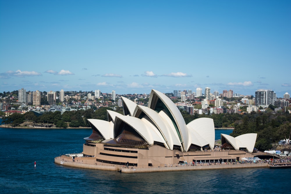 a large building with a city in the background