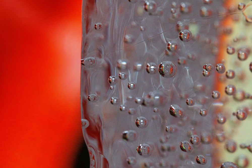 a bunch of water drops on a glass