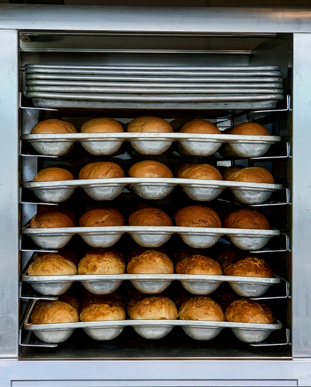 a group of pastries in a fridge