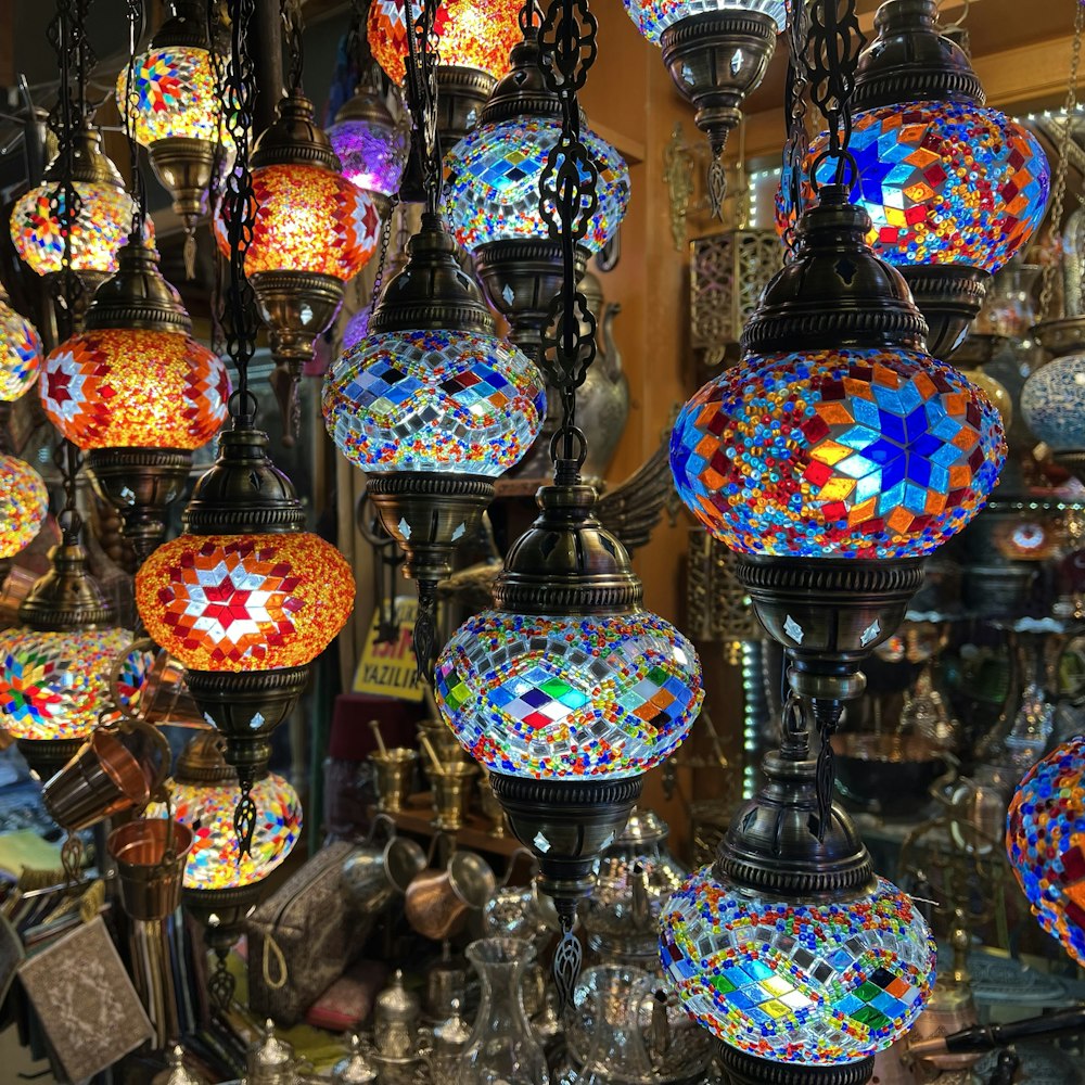 a group of colorful glass lamps