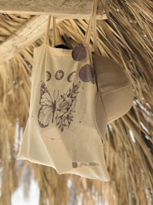 a white and brown shirt from a rope